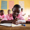 Gloria kan godt lide at gå i skole. Hun går i 3. klasse på Mwaeba Primary. Foto: Hans Bach.