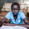 Samuel med sit skolehæfte - hans bedste fag er natur og teknologi, som de kalder Science i Sydsudan - foto: William Vest-Lillesøe